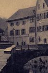 Hauptgebäude vom Kocher aus, im Vordergrund der Steinerne Steg. Ausschnitt aus einer Postkarte von etwa 1920 (StadtA Schwäb. Hall PK 02523)