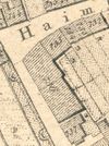 Ausschnitt aus dem Primärkataster  von 1827. Die „Hirtenscheuer“ hat die Nummer 736, links von ihrer Längsseite verläuft die Stadtmauer mit zwei Halbschalentürmen (halbrunde Strukturen) (StadtA SHA S13/0583)